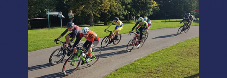 A group of six cyclists on the road