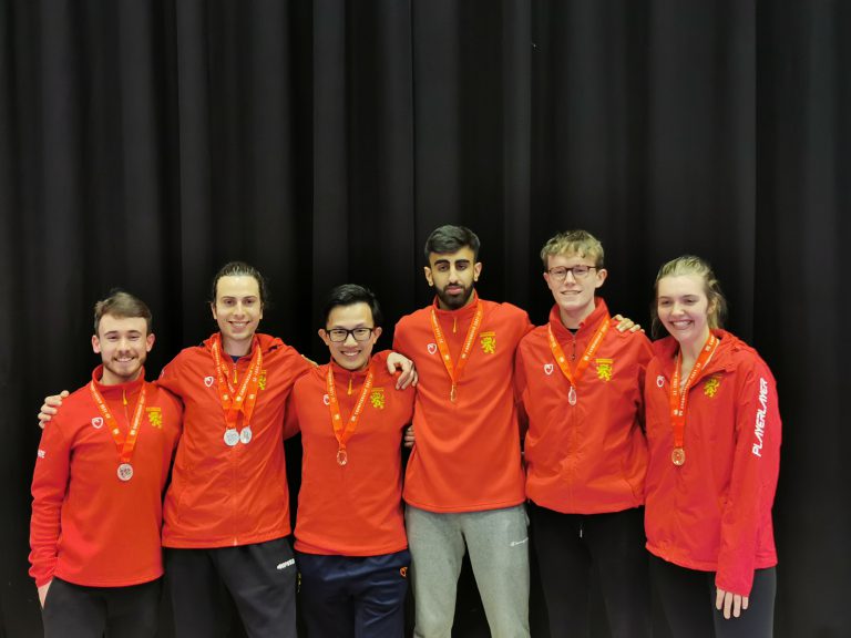 Six University of Birmingham athletes wearing their medals at the BUCS Karate Championship