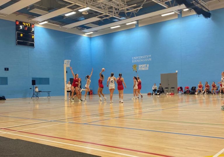 University of Birmingham netball player takes a shot during a game in the Munrow Arena