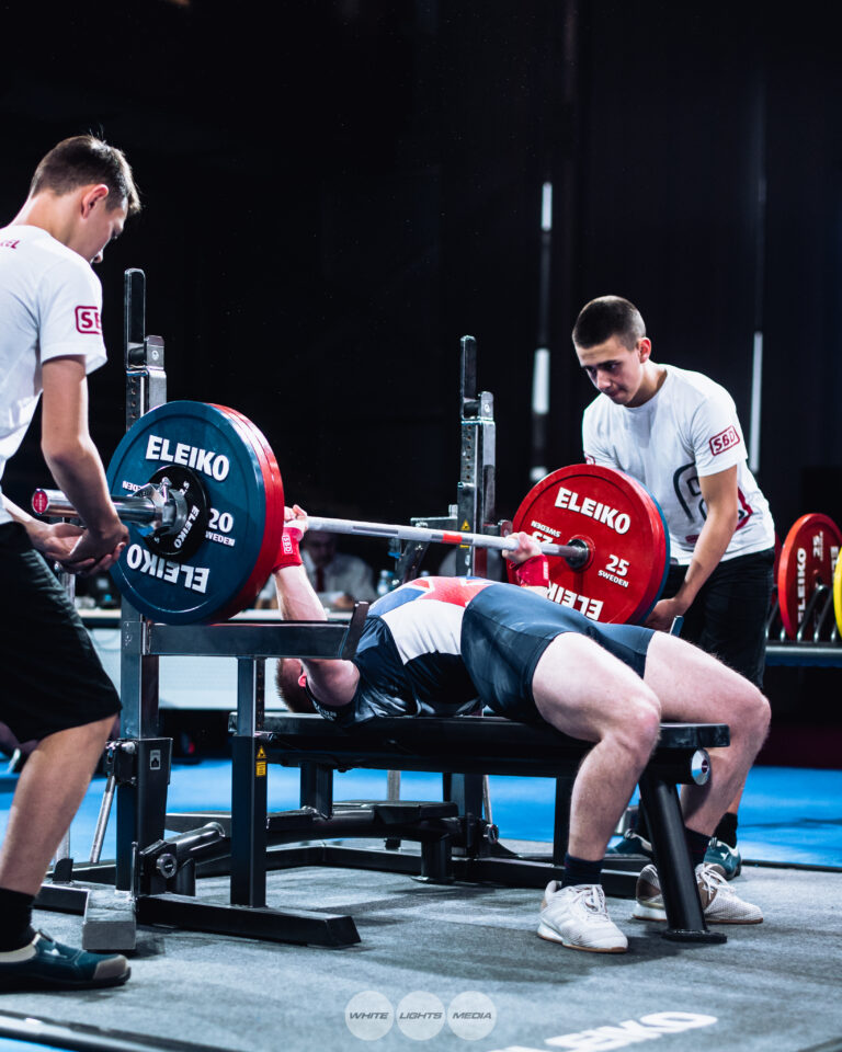 Image of Andrew Ward bench pressing at a championship