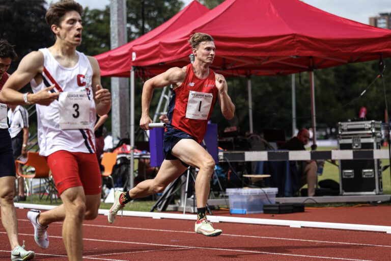 Picture of UOB athlete running alongside Ivy League competitor