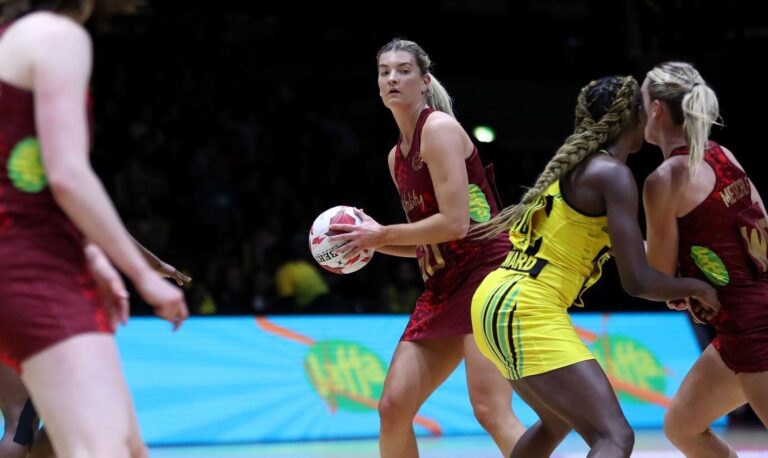 Fran playing Netball in Vitaly Roses Kit