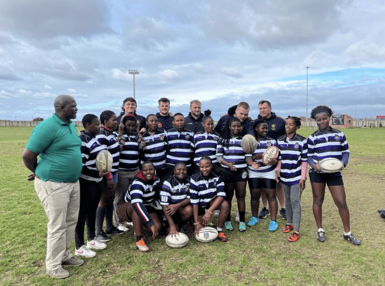 Local South African team with University of Birmingham Rugby Union smiling for group photo