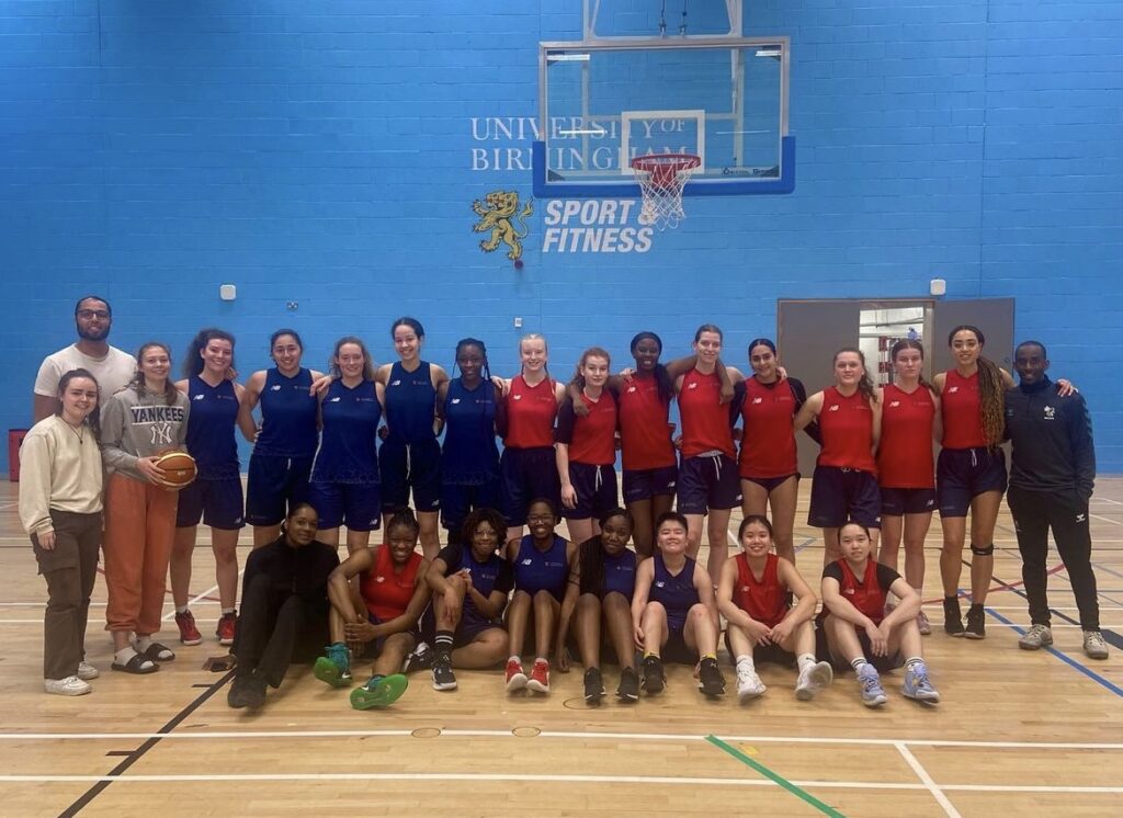 Womens social basketball group photograph underneath the basketball net in UoB Sport & Fitness