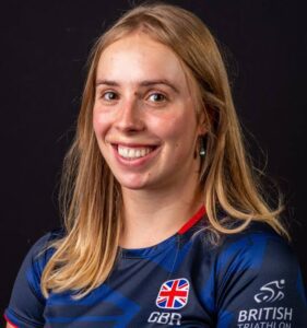 Sports scholar Megan Richter wearing her British Triathlon kit, smiling at the camera