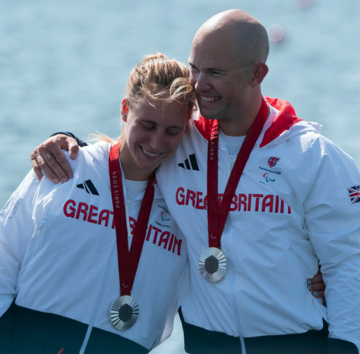 Annie Caddick with fellow rower, medals around necks