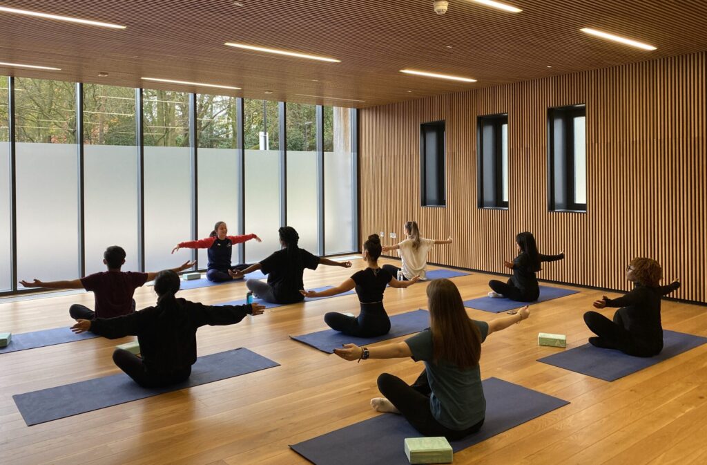 Active Residences yoga session with mats on floor