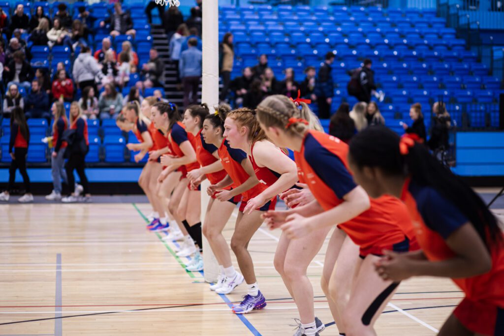 Netball Women's team lined up about to run at Intercept Super Series