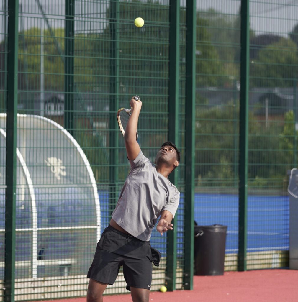 Man playing tennis on the court