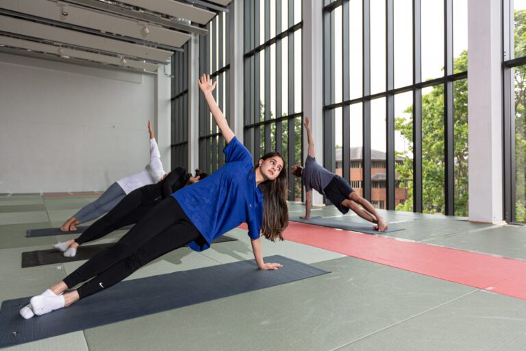 Woman doin yoga in Dojo studio