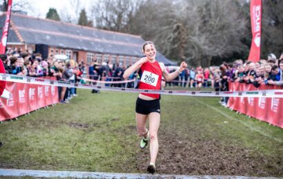 Jess Bailey running towards finish line - Women's winner