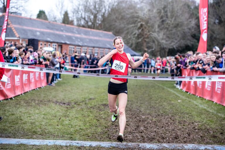 Jess Bailey running towards finish line - Women's winner