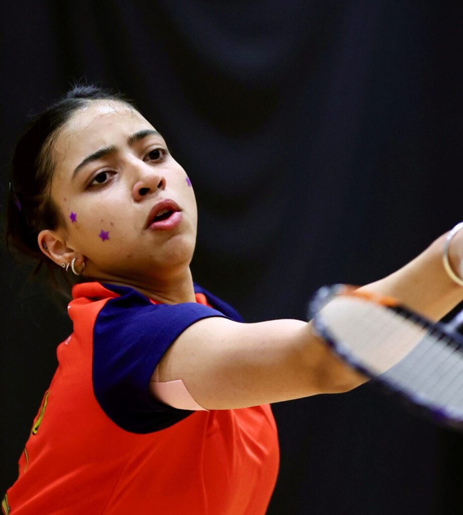 Samayara Panwar hitting shuttlecock with badminton racket in hand.