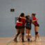 Women's volleyball team hugging